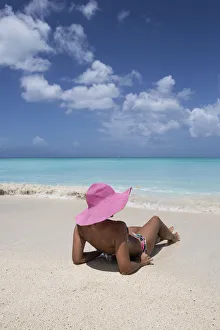 Images Dated 9th September 2016: Sunbathe on the beach facing the turquoise water of the Caribbean sea, The Nest, Antigua