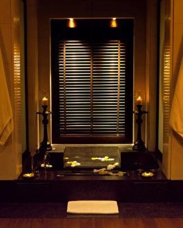Muscat Prints: The sunken bath is filled with flowers and flanked