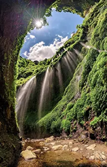 Environment Prints: Sunlight filters through a narrow canyon above Madakaripura waterfall
