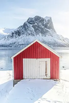 Beauty Prints: Sunlight over snowy mountains and fisherman cabin overlooking the arctic sea