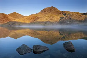 North Wales Prints: Sunlit Crib Goch and Snowdon mountains reflected in Llyn Llydaw, Snowdonia National Park
