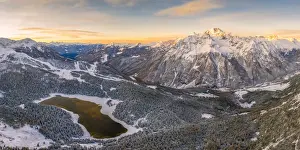 Sunrise aerial view of Lake Palu after an early snowfall Malenco Valley Valtellina Lombardy Italy