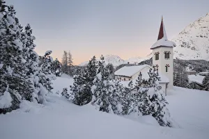Bregaglia Prints: The sunrise at Chiesa Bianca surrounded by snow, Maloja, Bregaglia Valley, Canton