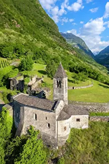 Vine Prints: Sunrise church of Santa Perpetua dominating the city of Tirano