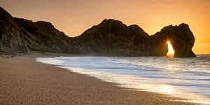 Sunrise Through Durdle Door, Dorset, England