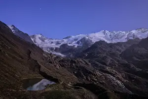 Star Prints: Sunrise over Forni glacier and Rosole lake framed by snowy mountains