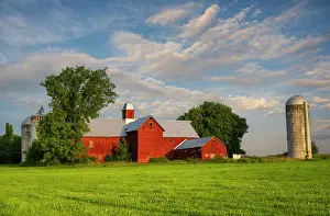 Pastoral Prints: Sunrise at historic red barn with silos, Green Mountains, Charlotte, Vermont, USA
