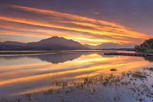 Brianza Prints: Sunrise on lake Pusiano with fire reflections, Lecco province, Brianza, Lombardy, Italy