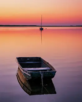 Estuary Prints: Sunrise from a marsh on Cape Cod with a single rowboat, Orleans, Massachusetts, USA