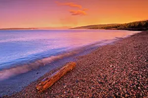 Power Prints: Sunrise on pebble beach of Lake Superior with driftwood Schreiber, Ontario, Canada
