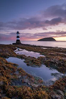 Anglesey Prints: Sunrise over Penmon Point lighthouse, Anglesey, North Wales, UK. Autumn (September) 2017