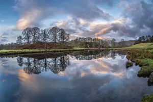 Sunrise reflected in the River Brathay near Elter Water, Lake District National Park