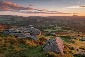 Sunrise over rolling countryside from Corndon Tor, Dartmoor, Devon, England. Autumn (October) 2016
