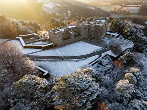 December Prints: Sunrise over snow covered Castle Drogo on a chill winter morning