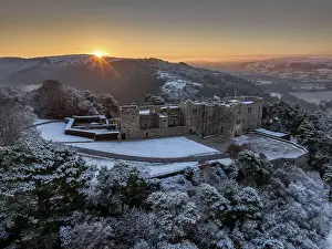 December Prints: Sunrise over snow covered Castle Drogo on a chill winter morning