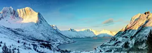 Breidtinden Prints: Sunrise over the snowy Breidtinden mountain and Mefjordbotn in winter