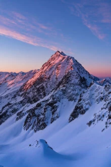 Sunrisescape from a summit of Stelvio National Park during winter