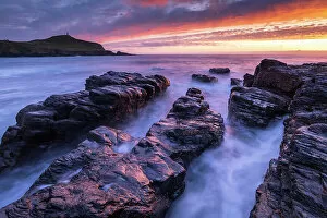 Images Dated 5th July 2022: Sunset over Cape Cornwall from the rocky shores of Porth Ledden, Cornwall, England