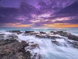 Motion Prints: Sunset on the Caribbean Sea along the rugged ironshore of Grand Cayman