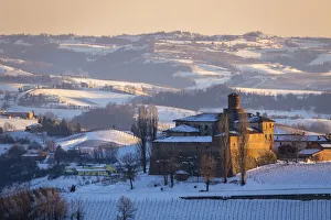 Sunset on the Castello di La Volta in winter. Barolo, Barolo wine region, Langhe