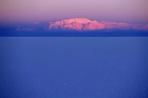 Salar De Uyuni Gallery: At sunset a cloud is painted pink by the last rays