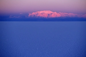 Salar De Uyuni Gallery: At sunset a cloud is painted pink by the last rays