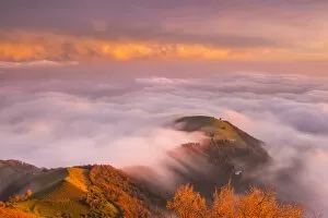 The sunset above the clouds over Prealpi Orobiche. Bronzone Mount (Prealpi Orobiche)