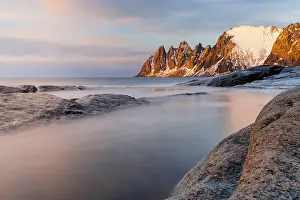 Snowcapped Mountain Prints: Sunset over Devil's Teeth sharp snowy pinnacles from Tungeneset