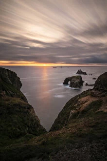 Sunset over Enys Dodnan, Armoured Knight and Longships Lighthouse, Lands End, Cornwall