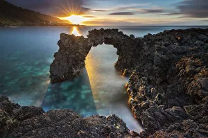 Sunset at Faja da Ribeira da Areia and its arch, Sao Jorge, Azores, Portugal