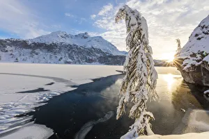 Lake Sils Prints: Sunset on frozen Lake Sils, Plaun da Lej, Maloja Region, Canton of Graubunden, Engadin