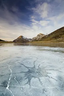 Bernina Pass Prints: Sunset on the frozen Lej Nair surrounded by rocky peaks Bernina Pass Canton of Graubunden