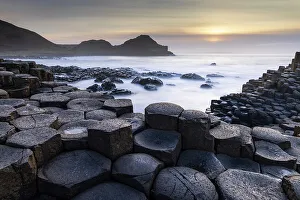 Sunset over the Giant's Causeway on the Causeway Coast, Bushmills, County Antrim, Northern Ireland. Spring (March) 2024