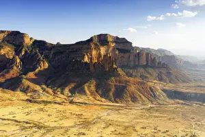 Ethiopia Prints: Sunset lit Gheralta Mountains and Abuna Yemata Guh rock hewn church, aerial view, Hawzen