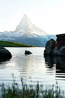 Rippled Prints: Sunset mist over Matterhorn peak mirrored in lake Stellisee