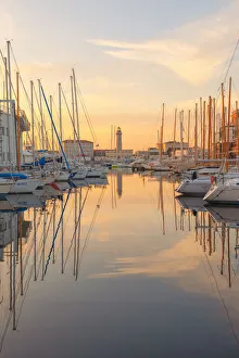 Images Dated 22nd March 2019: Sunset on the port of Trieste, with the old lighthouse. Trieste, Friuli-Venezia Giulia