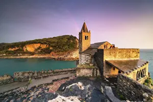 Sunset with rainbow on the San Pietro Church, municipality of Portovenere, La Spezia province, Liguria, Italy