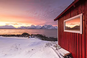 Kafjord Prints: The sunset reflected on the glass of a typical red house