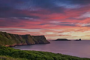 Images Dated 11th August 2021: Sunset over Rhossili Bay & Worms Head, Gower Peninsula, West Glamorgan, Wales