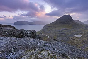 Sunset over the rugged mountains of Streymoy, Faroe Islands, Denmark, Europe. Summer