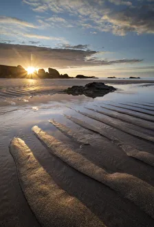 Sunset over the sandy beach at Porthcothan Bay, Cornwall, England. Autumn (October) 2019