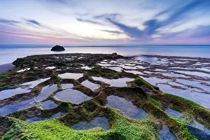 Shape Prints: Sunset over seaweed and rock formations on Cofete beach