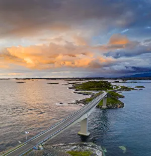 Sunset over Storseisundet Bridge on the Atlantic Road, aerial view