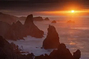 Northern Spain Prints: Sunset over the towering stacks of Urros de Liencres on the Broken Coast