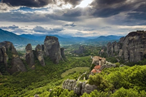 Sunset view over Monastery of Moni Agias Varvaras Roussanou and the spectacular massive Sunset view over Monastery of Moni Agias Varvaras Roussanou and the spectacular massive