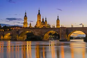 Dome Prints: Sunset view of Puente de Piedra bridge with Basilica de Nuestra Senora del Pilar church