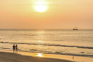 Walker Prints: Sunset walkers on the northern beach of Norderney
