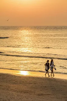 Walker Prints: Sunset walkers on the northern beach of Norderney