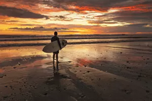 Pacific Gallery: Surfer at Playa Santa Teresa at sunset, Peninsula de Nicoya, Guanacaste, Costa Rica