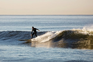 South Western Prints: Surfer at sunrise, Santa Monica, California, USA